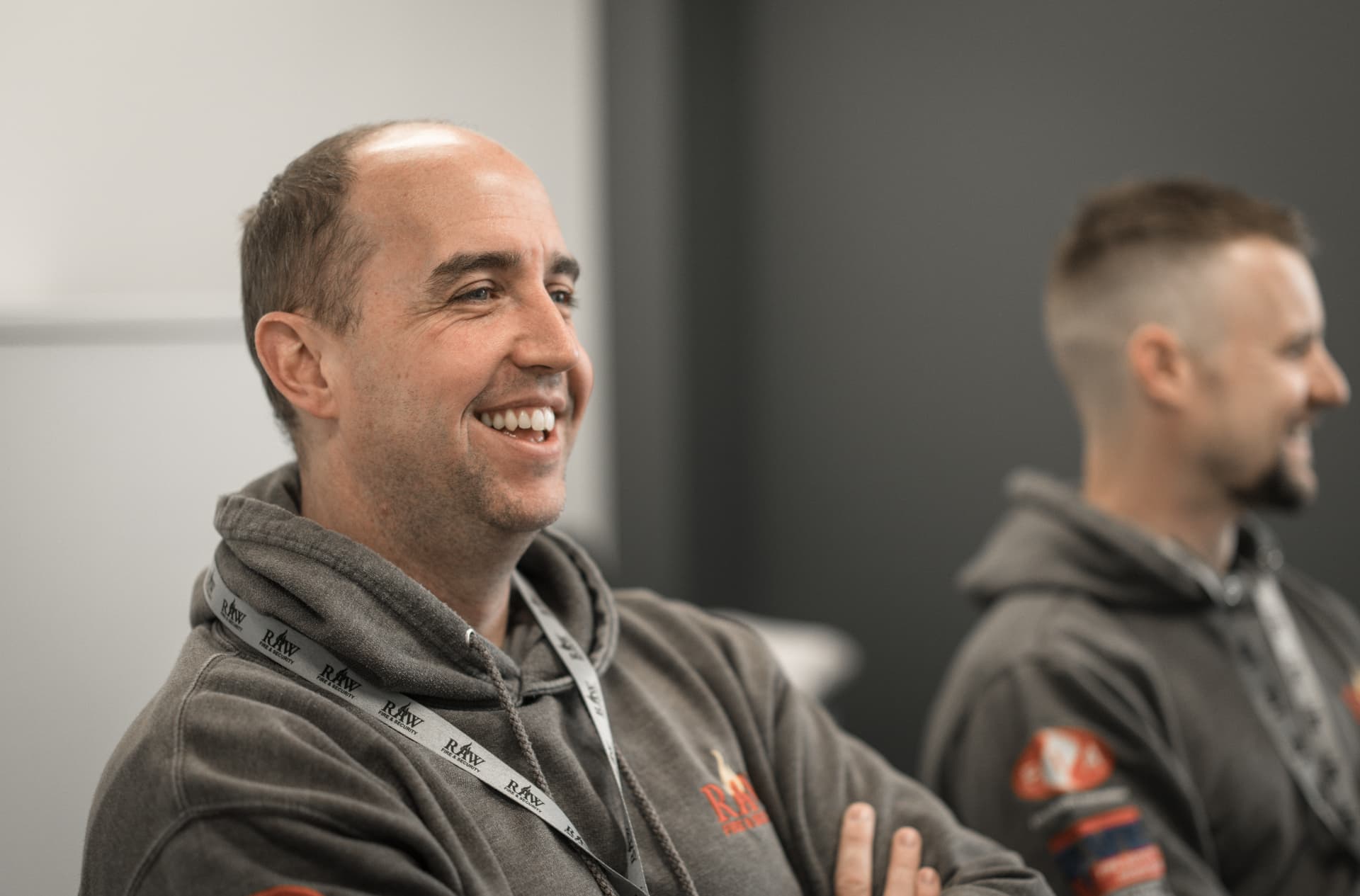 RAW engineers laughing together at a team meeting
